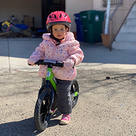 toddler on a balance bike
