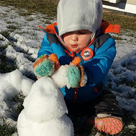 Kingsley building a snowman