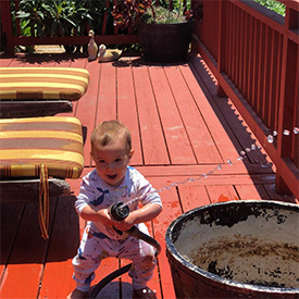Aurora with hose at 10 months