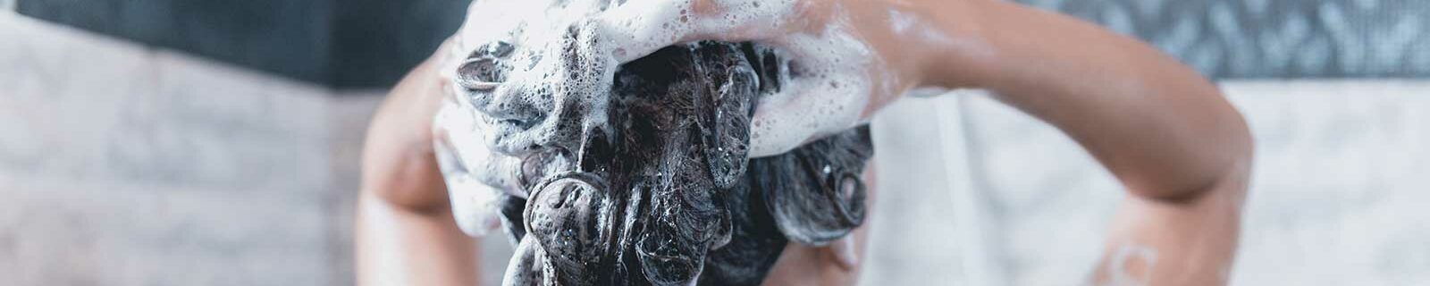 woman shampooing hair