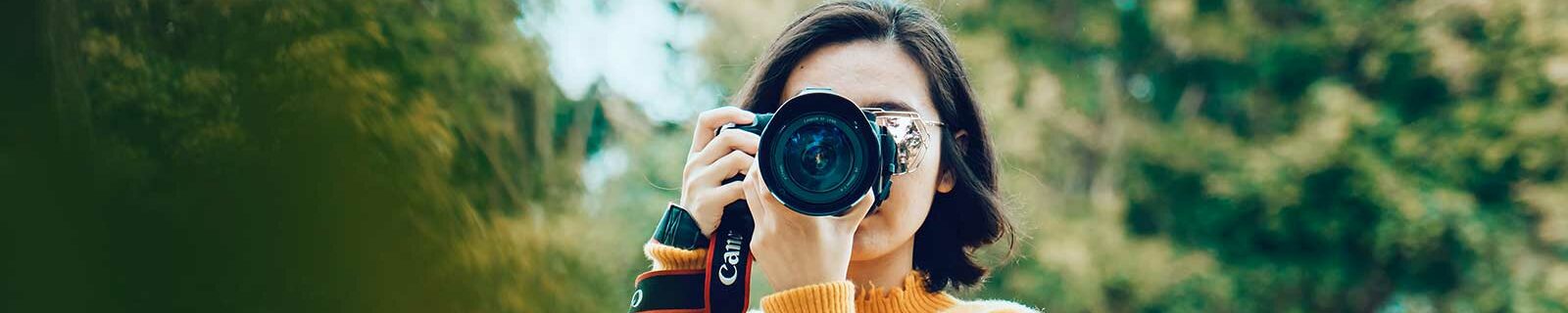 Girl taking photos with digital camera