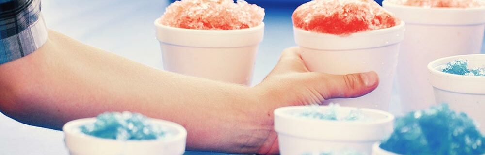 Man serving flavored shaved ice