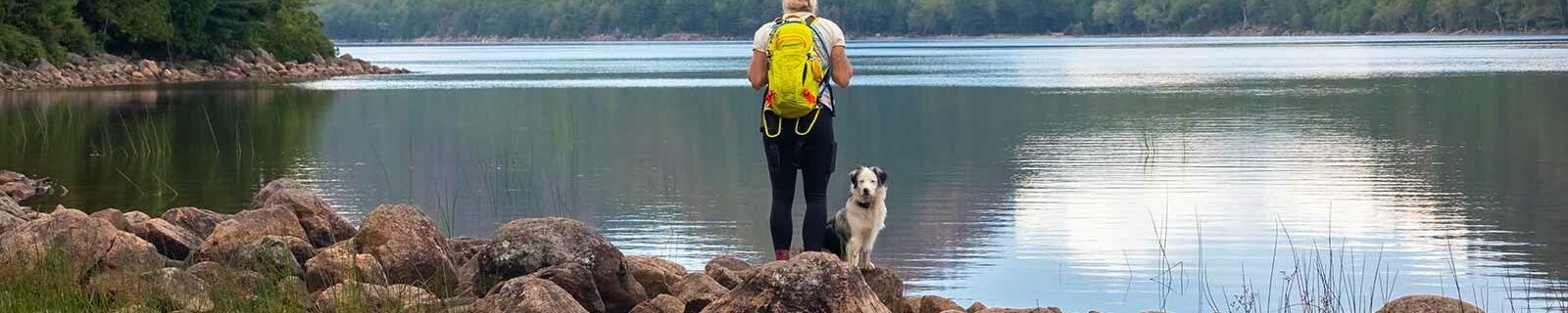 Enjoying a lake in Maine with dog