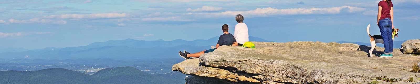 Family with dog on cliff in virginia