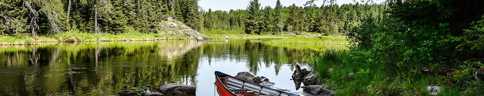 Minnesota lake with red boat